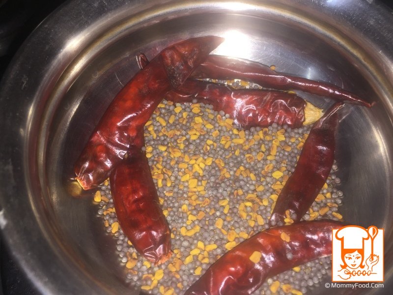 Add and stir fry 6 dry red chillies for a minute in low flame