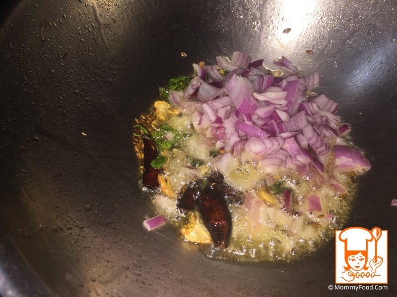 In talimpu saute chopped onions and turmeric powder. stir fry for a minute in high flame